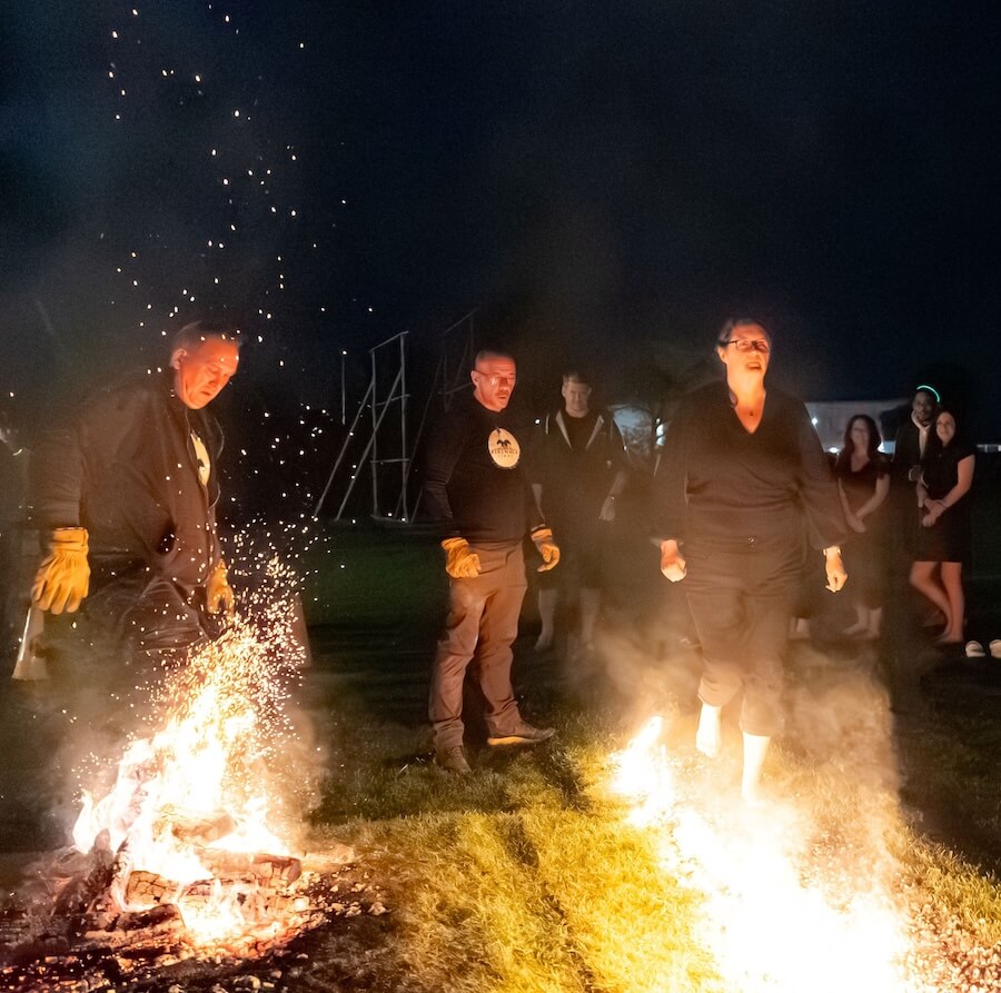 SWA CEO Kate Rowland steps onto the flames. Photo courtesy of Stephen Baron Photography-2