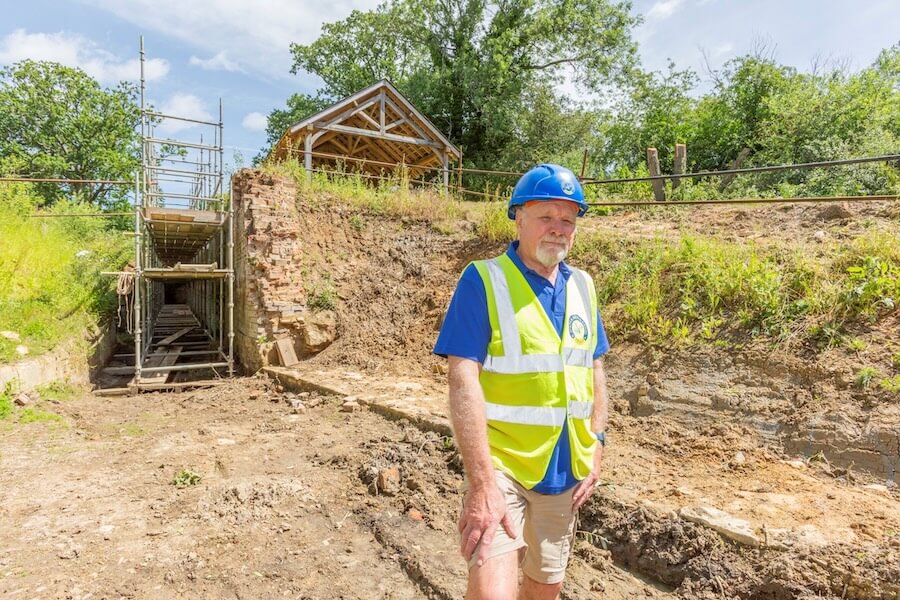 WBCT Pewsham Locks Bottom Lock with Roger Noyce (photo by Stephen Lewis)-2 Project lead Roger Noyce in front of Bottom Lock, with the recently restored dry dock in the background
